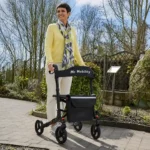 WalkSmart Plus Rollator Walker In use by happy lady outdoors in nature